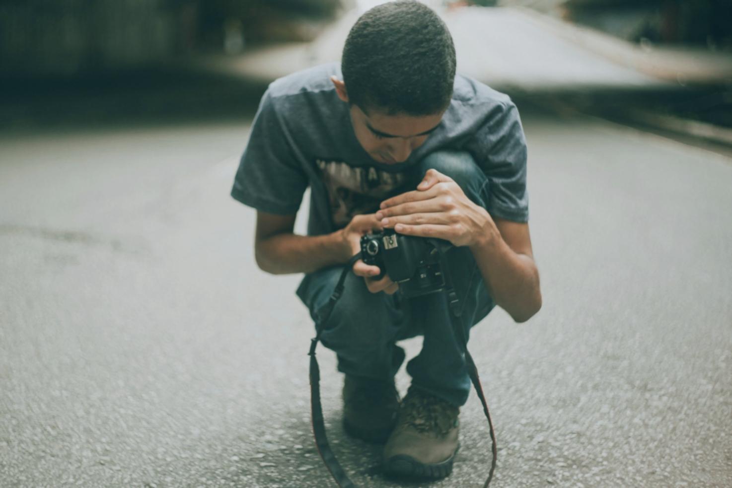 Wildlife photography student capturing nature in outdoor field session